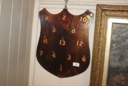 A 1920's stained beech shield shaped hotel key rac