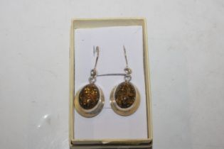 A large Sterling silver and amber pair of drop ear