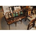 Three Ercol stick back dining chairs and two stick