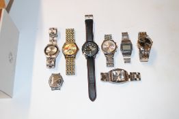 A box and contents of various wrist watches