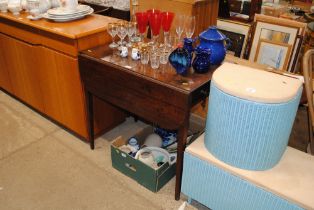 A 19th Century mahogany Pembroke table raised on s