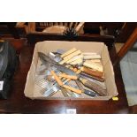 A box of various cutlery