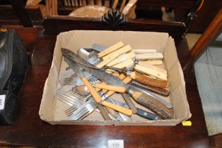 A box of various cutlery