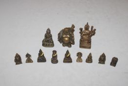 A collection of Eastern bronze figures of small si