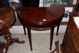 A 19th Century mahogany demi-lune shaped fold over