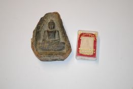 An ancient Asian pottery fragment of a seated Budd