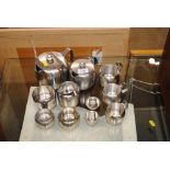 A quantity of stainless steel teaware