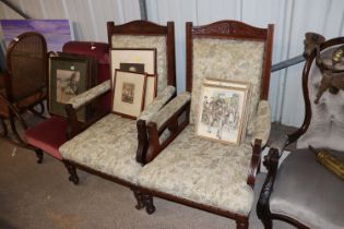 A pair of late Victorian carved deep seated armcha