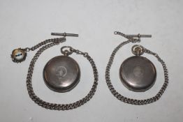 Two silver cased pocket watches - both with silver