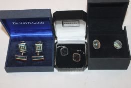 Three pairs of silver cufflinks and one other