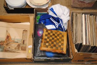 A box containing a games box, various books, Ipswi