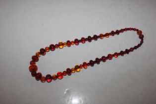 A large amber bead necklace with concealed clasp,