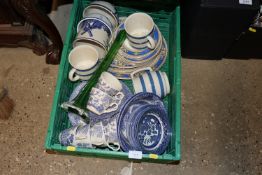 A box containing various blue and white china to i