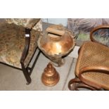 A large ornate copper lamp