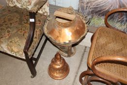 A large ornate copper lamp