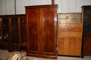 A Victorian mahogany wardrobe fitted sliding trays