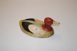 A painted wooden decoy pochard duck
