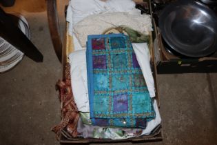 A box of various table napery and textiles