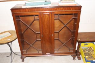 A mahogany astragal glazed bookcase, raised on squ