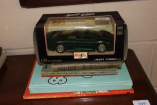 A Maisto die-cast model of a Jaguar XJ220; a Stanl