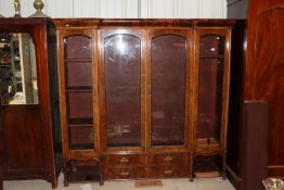 A Victorian burr walnut break front bookcase fitte