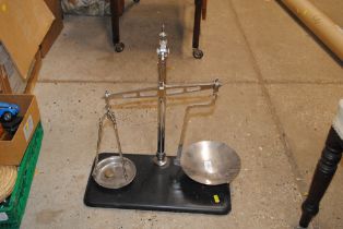 A set of balance scales; and a box of various sund