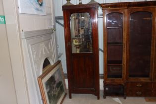 A mahogany mirror door single wardrobe