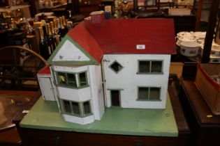 A vintage wooden dolls house