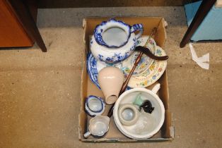 A wig stand and various blue and white china and g