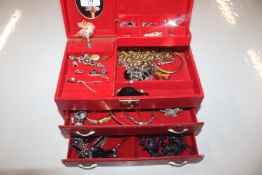 A cantilever jewellery box and contents of costume