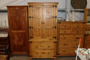 A pine wardrobe fitted two drawers to the base