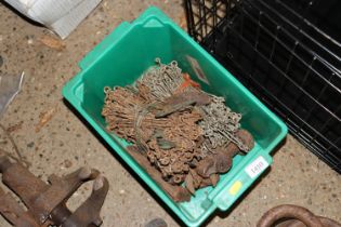 A box containing various vintage spanners etc