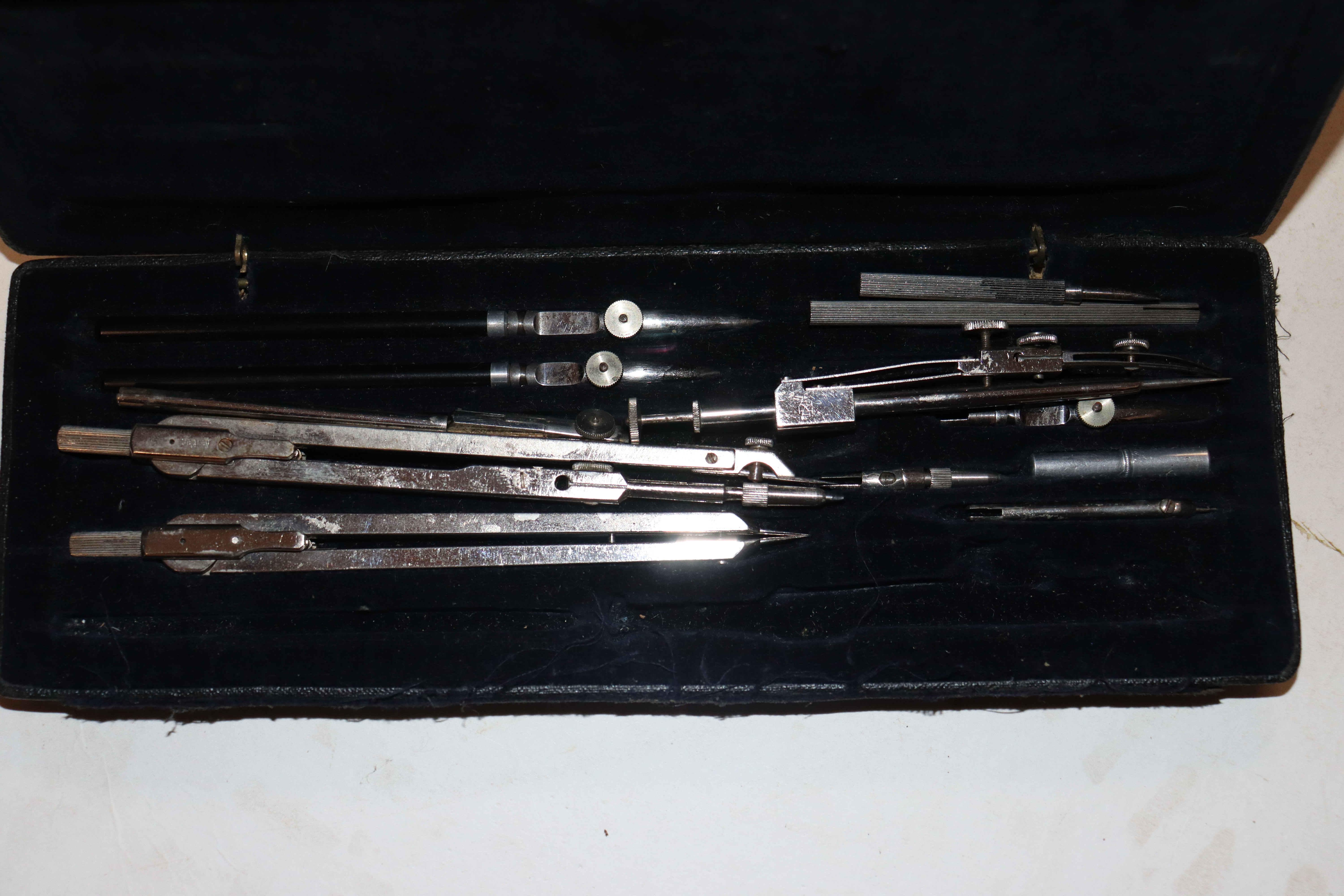 A cased set of geometry instruments and a engraving set - Image 4 of 4