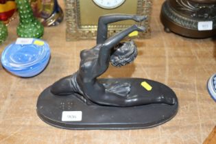 An Art Deco style figure of a naked dancing girl