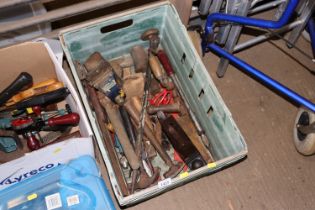 A plastic crate of various tools to include planes