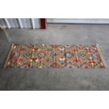 An approx 6'7" x 1'1" Chobi Kilim runner