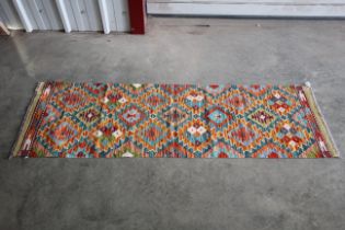 An approx 6'7" x 1'1" Chobi Kilim runner