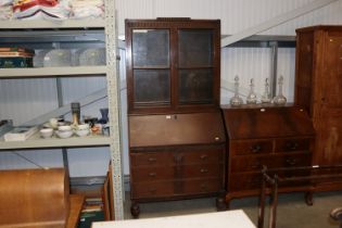 A 1930's oak bureau bookcase