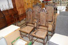 A pair of antique cane seat and back elbow chairs