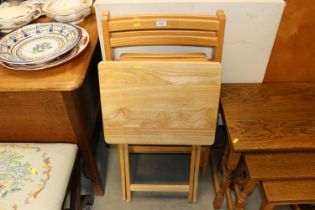 A pair of folding slatted chairs and a folding occ