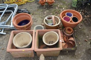 A large quantity of terracotta and other planters