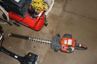 A Husqvarna X Series 325HD75 petrol hedge cutter