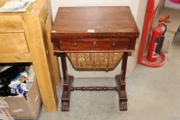 A Victorian mahogany sewing table with fold over to