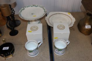 A pair of boxed Buckingham Palace mugs, a French p