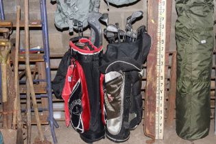 Two golf bags with clubs