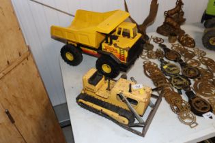 A Tonka Toys bulldozer and a Tonka Toys turbo dies