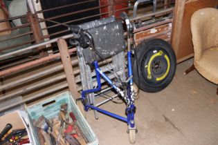 A mobility walker and two sets of aluminium steps