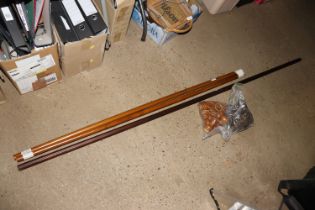 Two sets of wooden curtain poles with fittings and