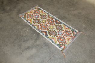 An approx 4'7" x 2' Chobi Kilim rug