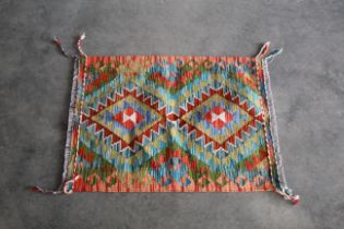 An approx 2'9" x 2' Chobi Kilim rug